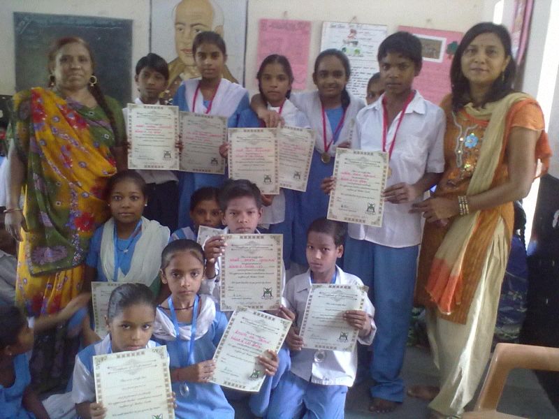Students receiving Certificates from Mrs. Anjana Nimabvat
